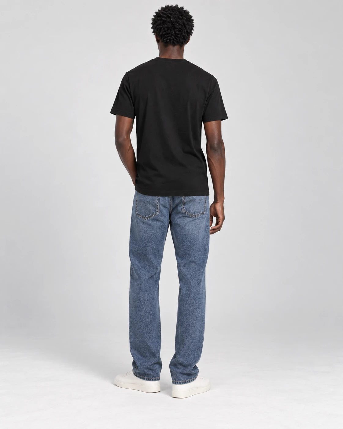 MOMANI Emblem Yoke T-Shirt in Black, worn by a model, back view