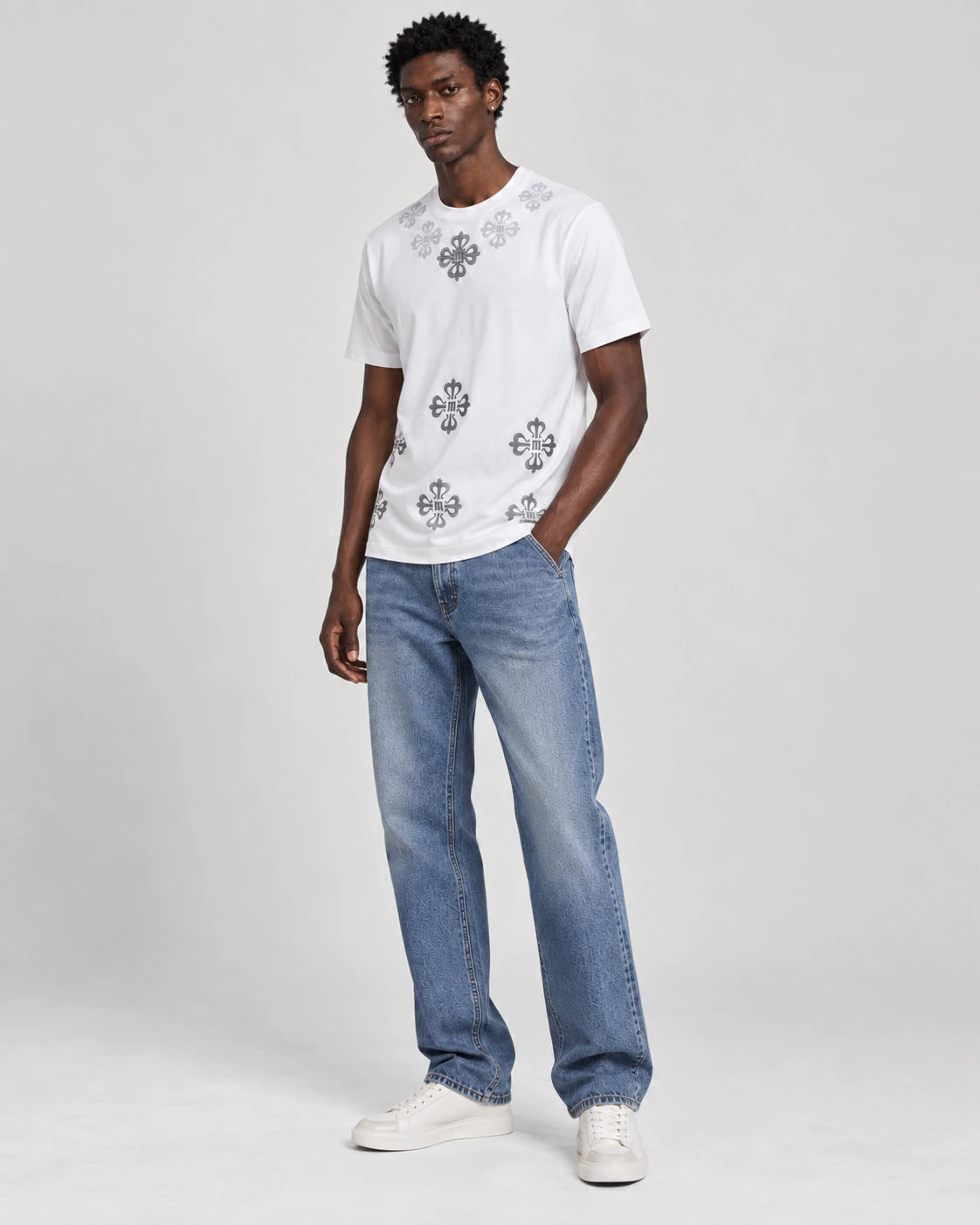 MOMANI Emblem Yoke T-Shirt in White, worn by a model, three-quarter view
