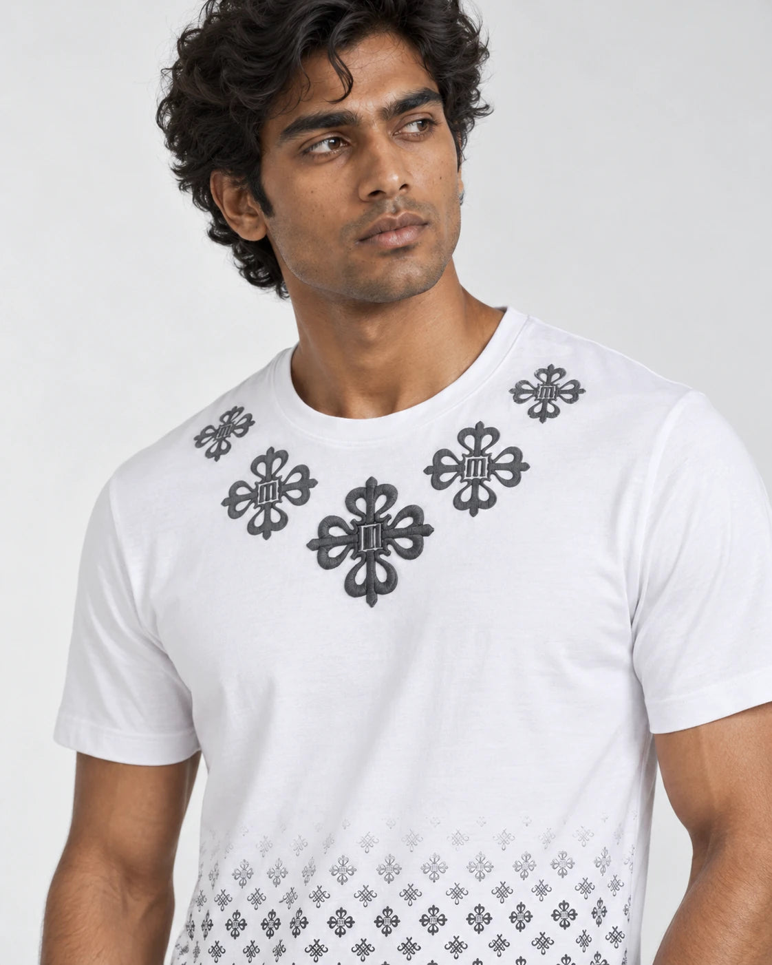 MOMANI Monogram Panel T-Shirt in White, worn by a model, close detail