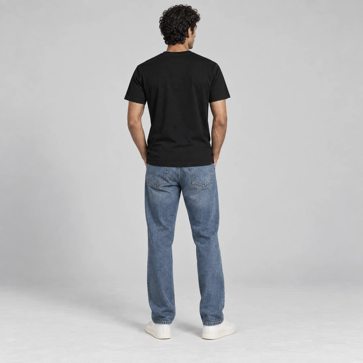 MOMANI Emblem Crest T-Shirt in Black, worn by a model, back view