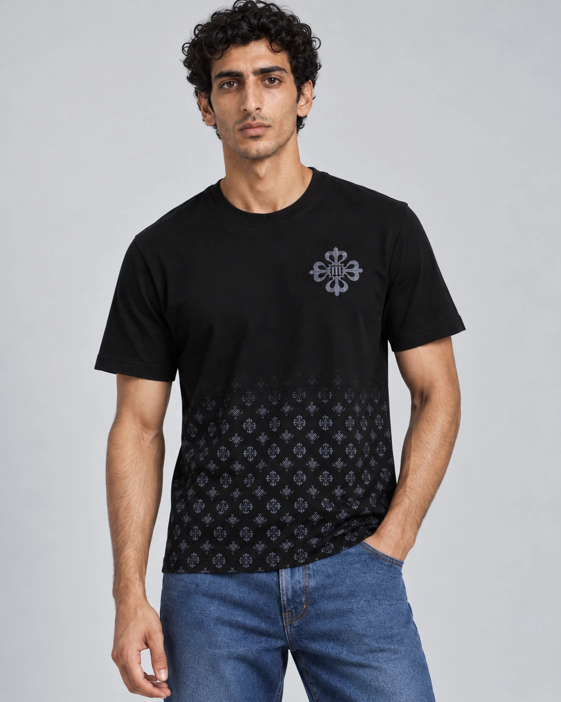 MOMANI Emblem Crest T-Shirt in Black, worn by a model, close detail