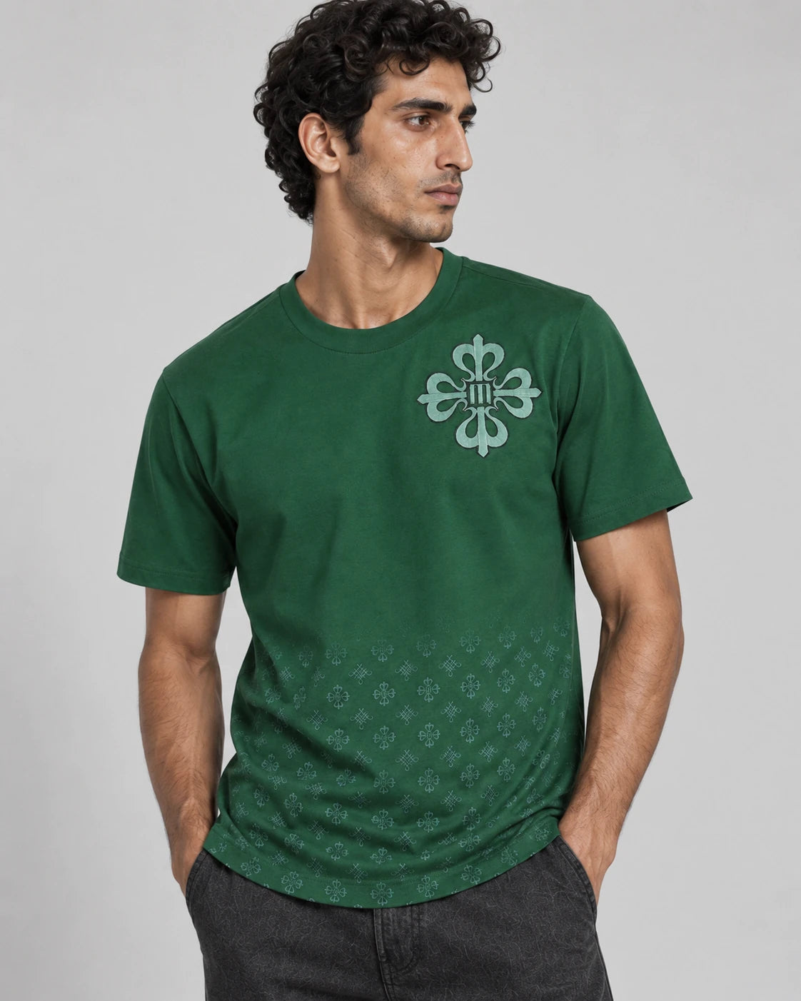 MOMANI Emblem Crest T-Shirt in Green, worn by a model, close detail