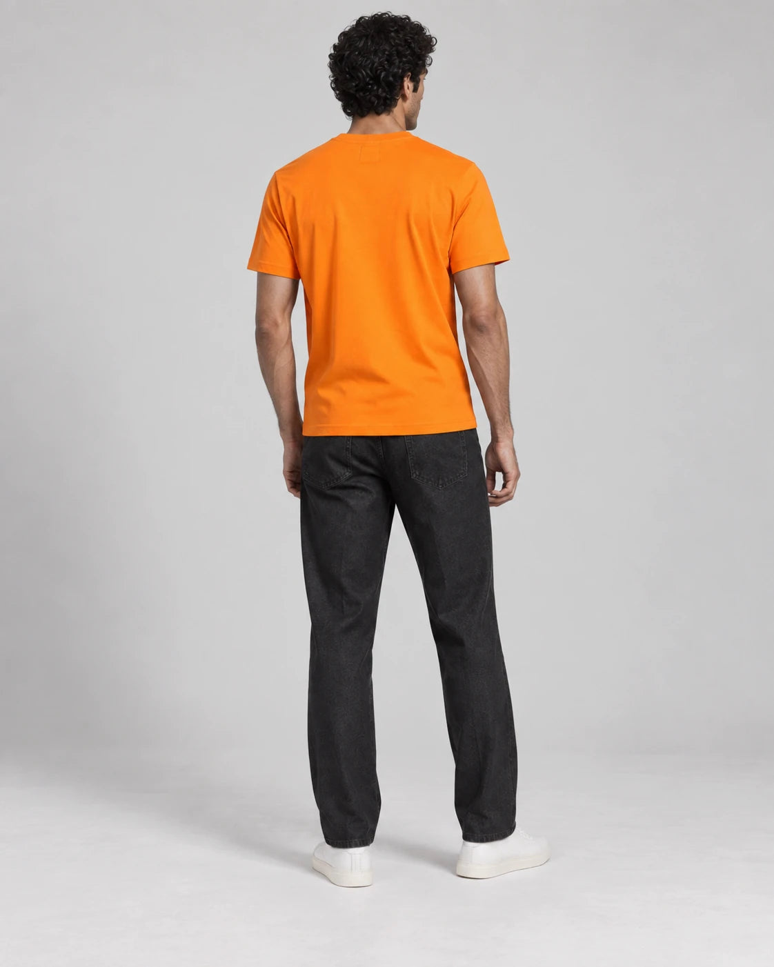 MOMANI Emblem Crest T-Shirt in Orange, worn by a model, back view