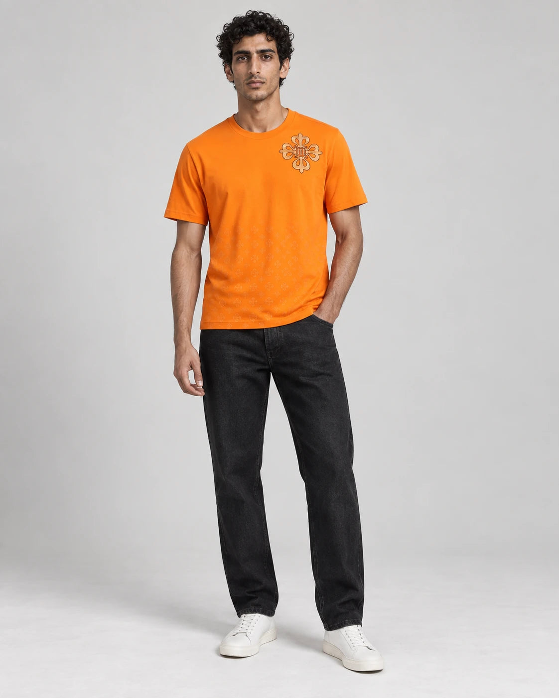 MOMANI Emblem Crest T-Shirt in Orange, worn by a model, front view