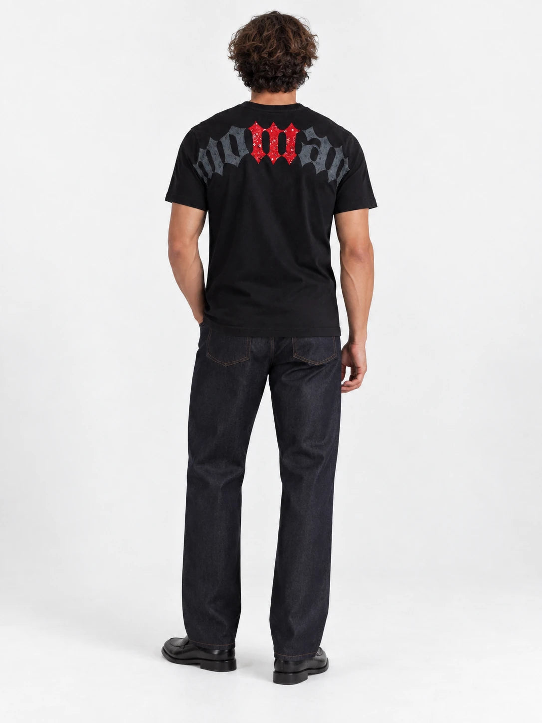 MOMANI Logotype T-Shirt in Black, worn by a model, back view