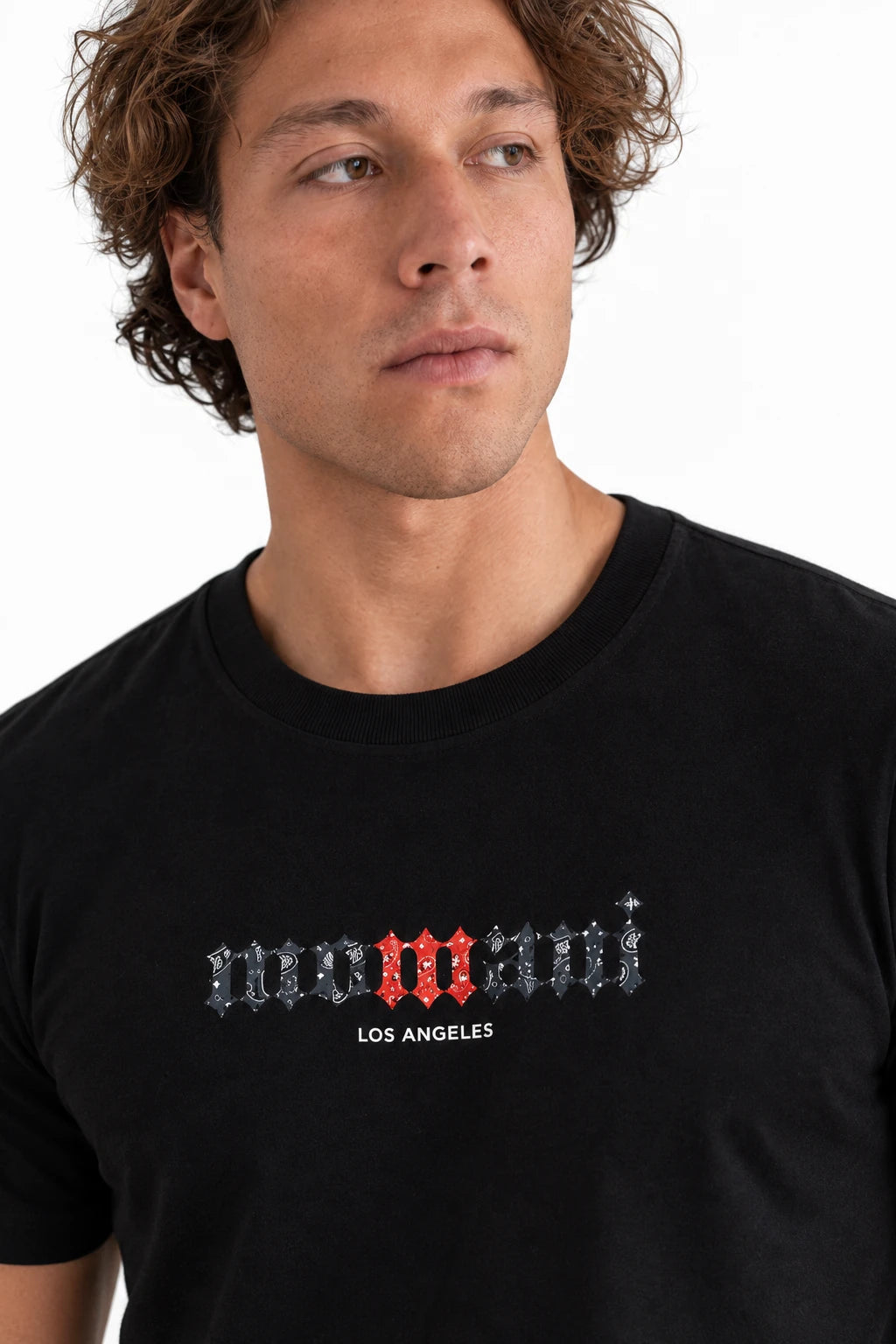 MOMANI Logotype T-Shirt in Black, worn by a model, close detail