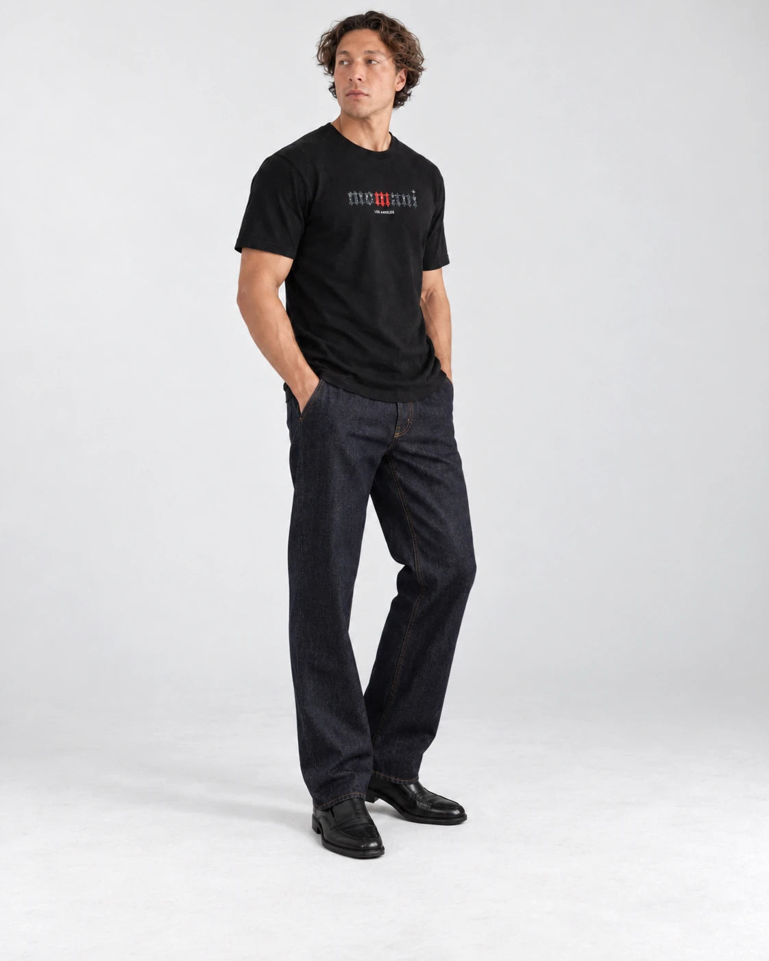 MOMANI Logotype T-Shirt in Black, worn by a model, three-quarter view