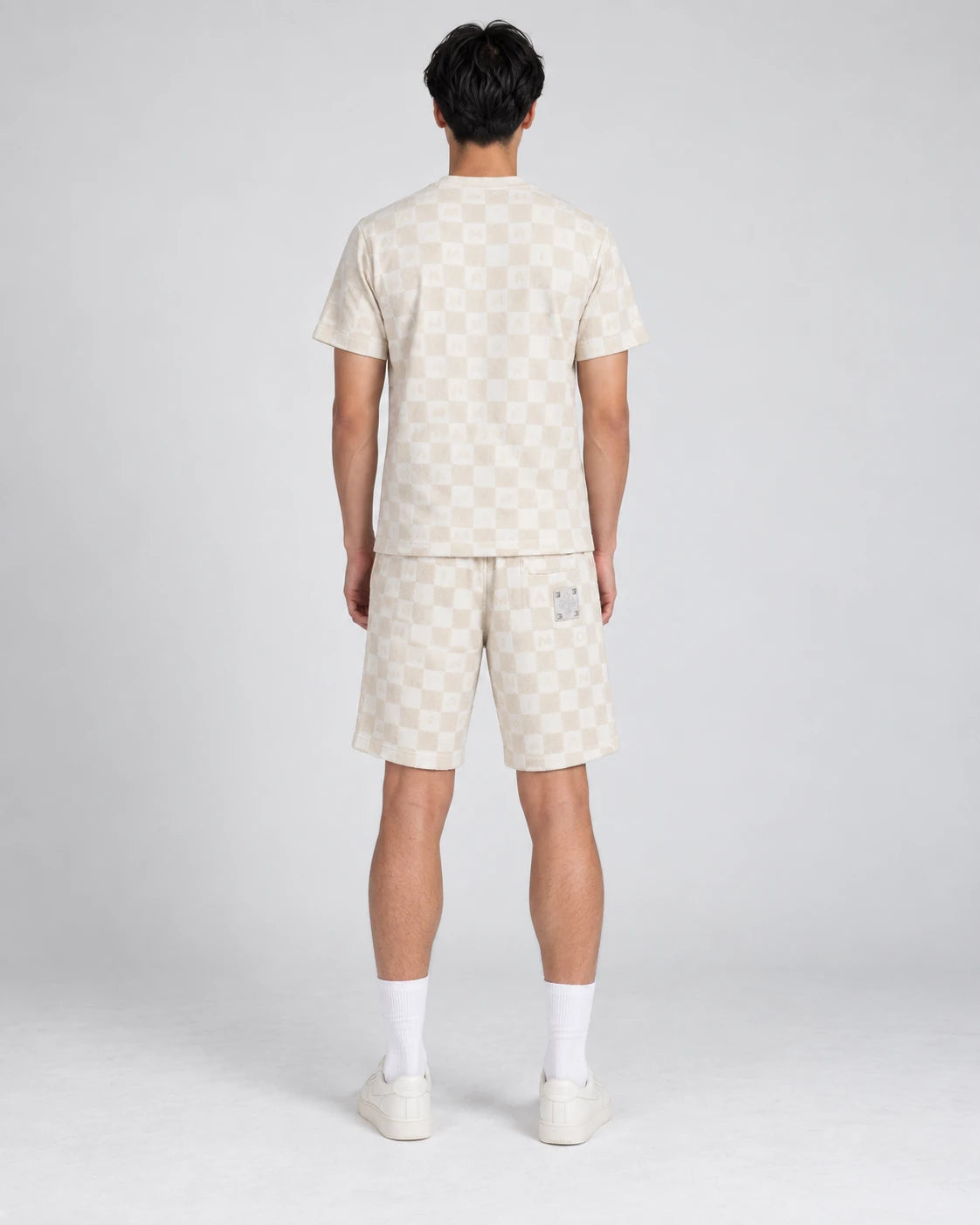 MOMANI Monogram Check T-Shirt in Cream, worn by a model, back view