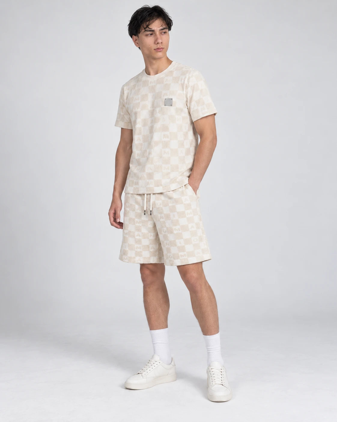 MOMANI Monogram Check T-Shirt in Cream, worn by a model, three-quarter view
