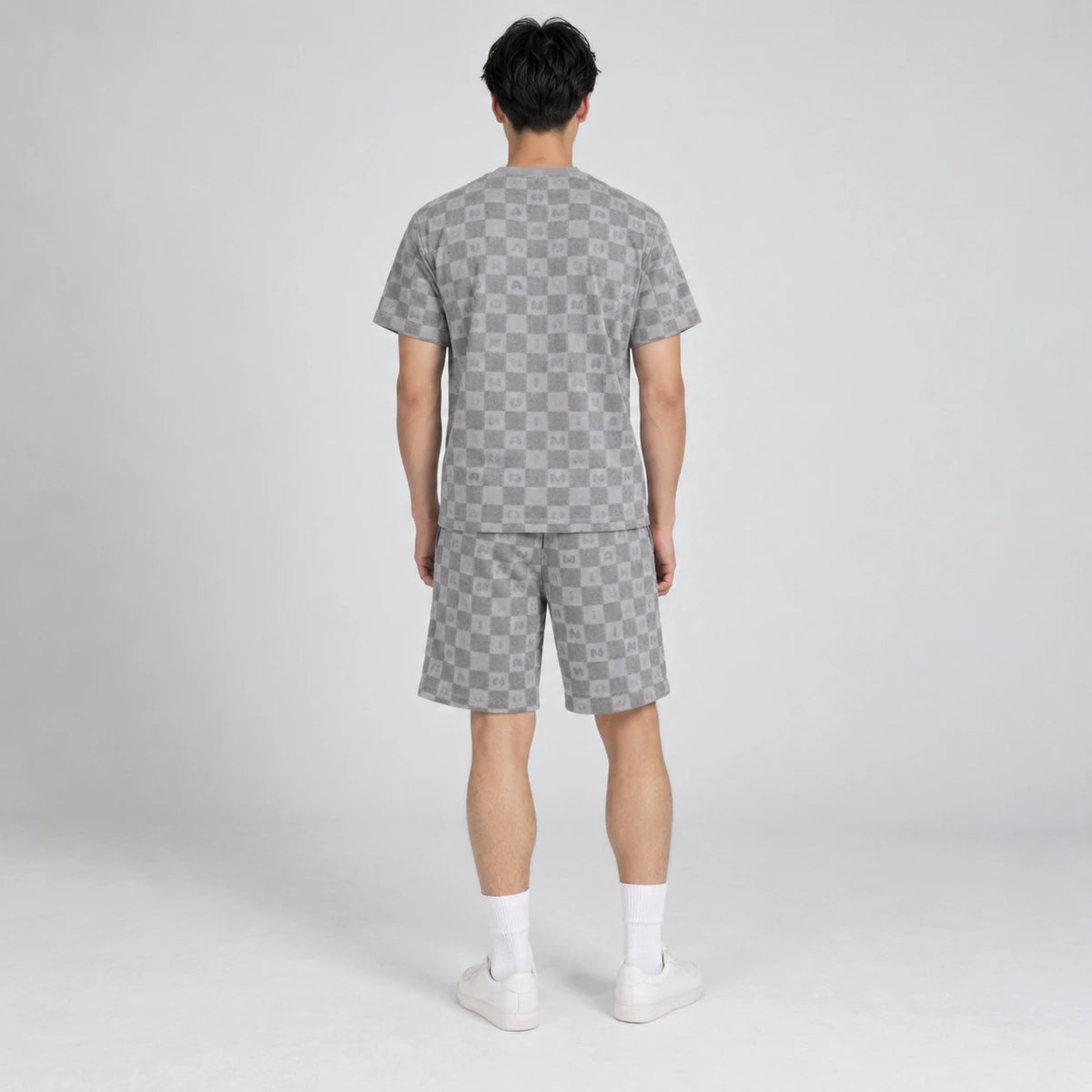 MOMANI Monogram Check T-Shirt in Grey, worn by a model, back view
