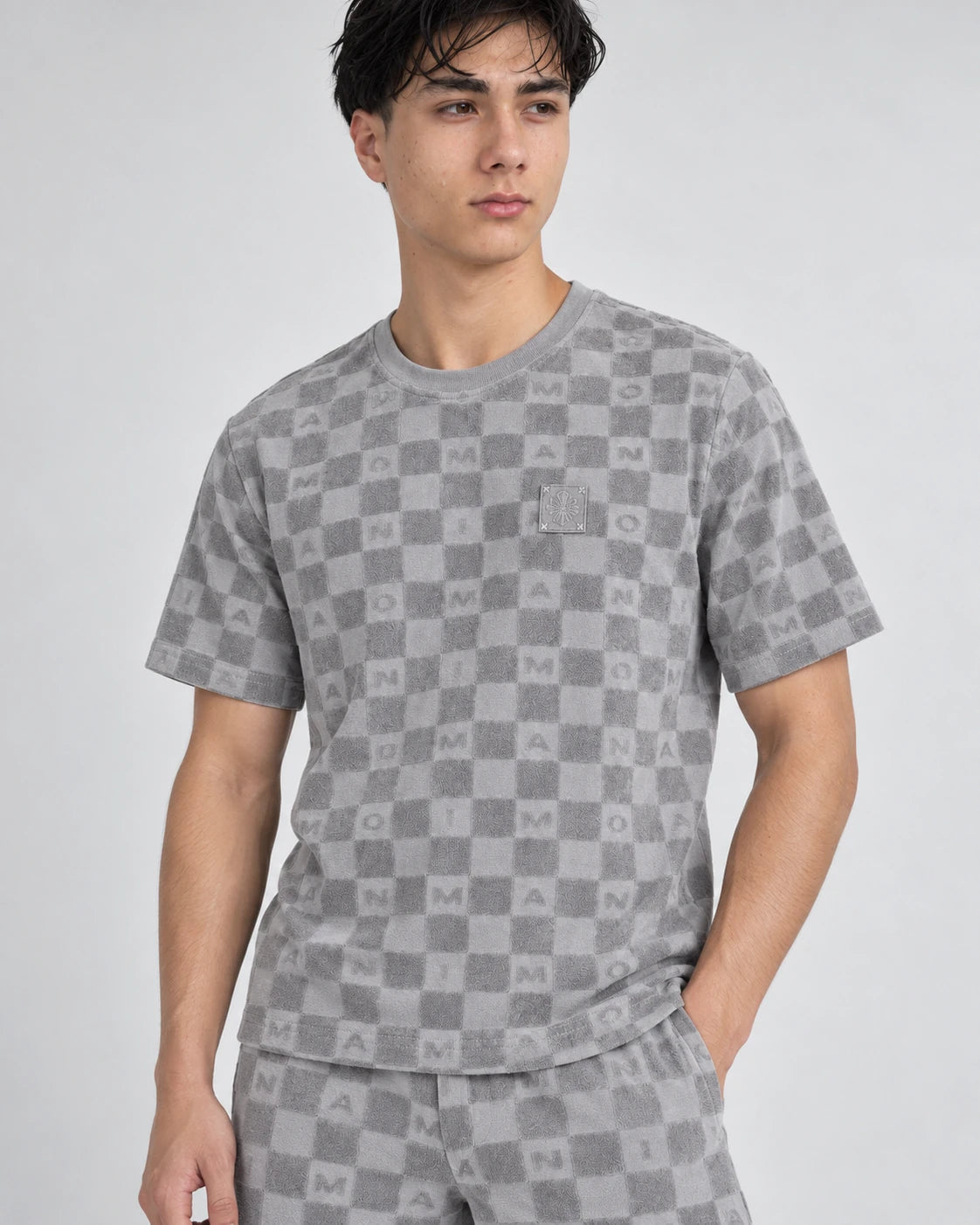 MOMANI Monogram Check T-Shirt in Grey, worn by a model, close detail
