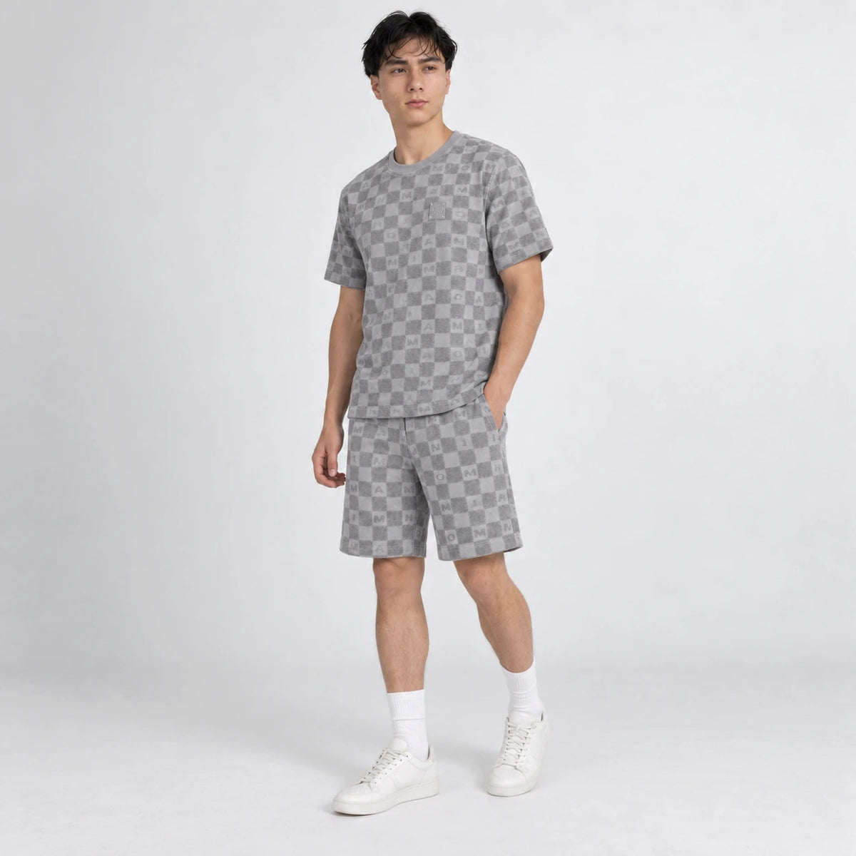 MOMANI Monogram Check T-Shirt in Grey, worn by a model, three-quarter view