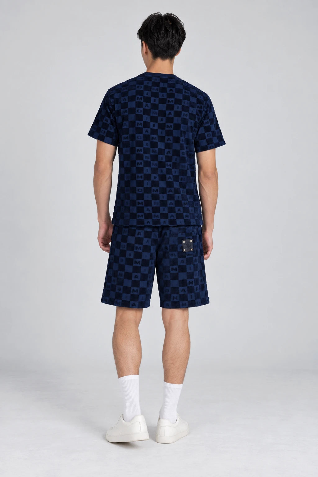 MOMANI Monogram Check T-Shirt in Navy, worn by a model, back view