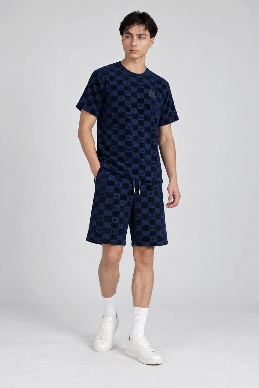 MOMANI Monogram Check T-Shirt in Navy, worn by a model, three-quarter view