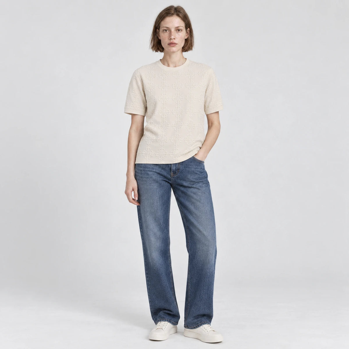 MOMANI Emblem Relief T-Shirt in Cream, worn by a model, front view