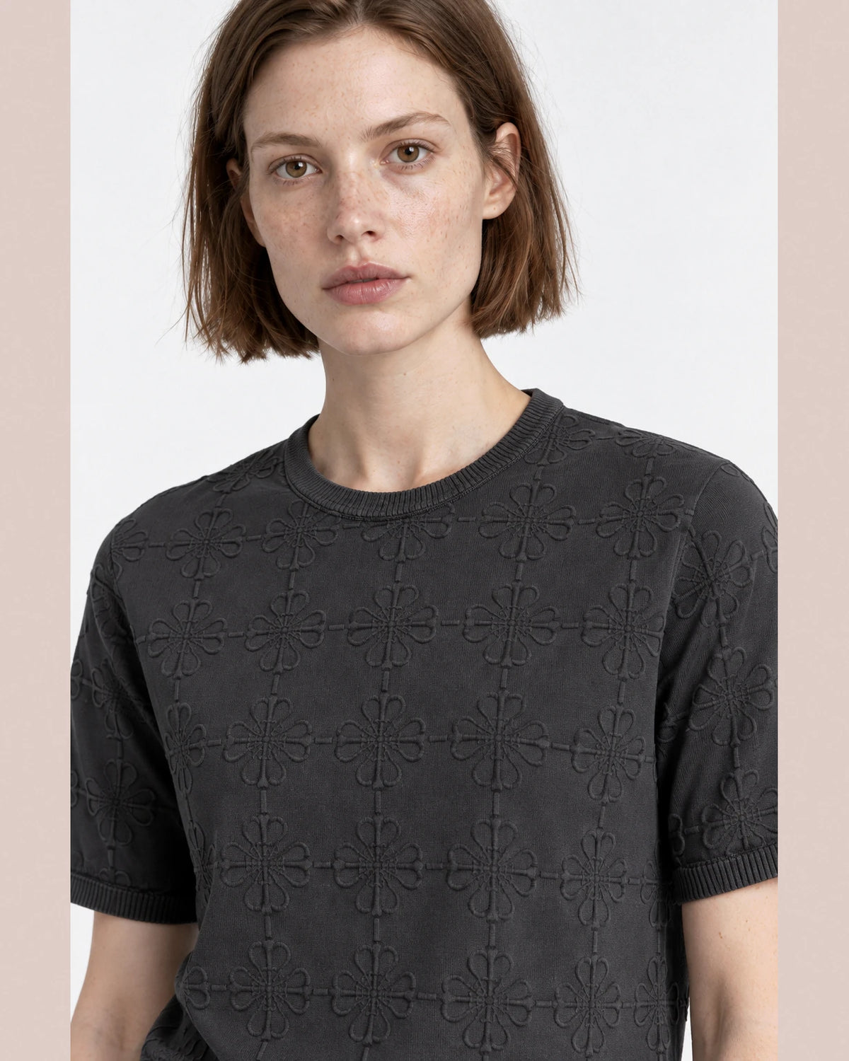 MOMANI Emblem Relief T-Shirt in Grey, worn by a model, close detail