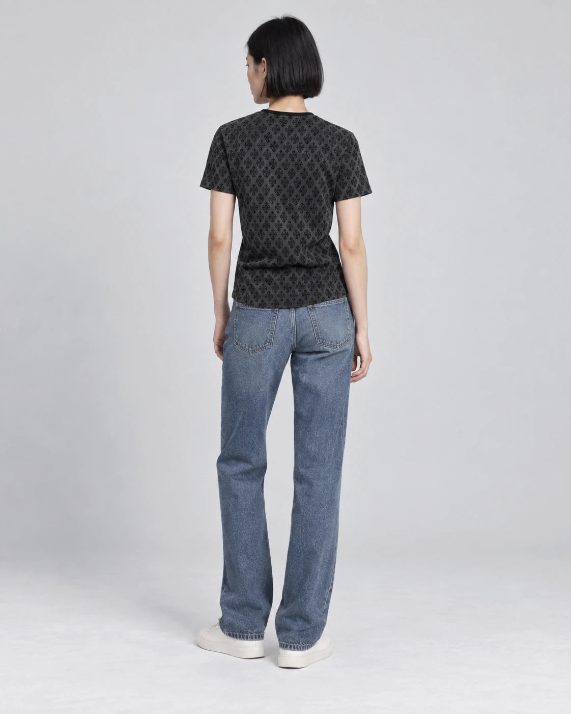 MOMANI Micro Emblem T-Shirt in Black, worn by a model, back view