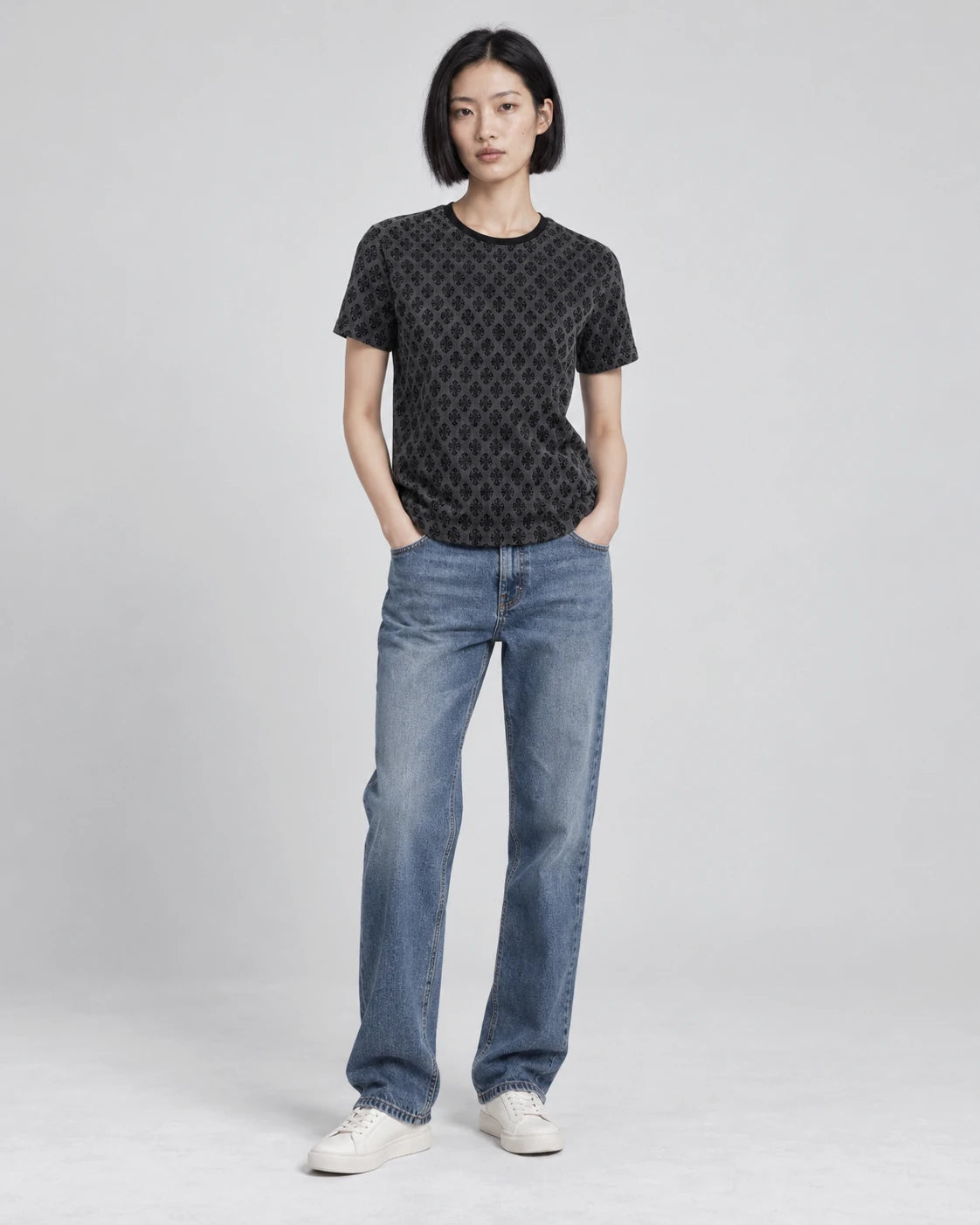 MOMANI Micro Emblem T-Shirt in Black, worn by a model, front view