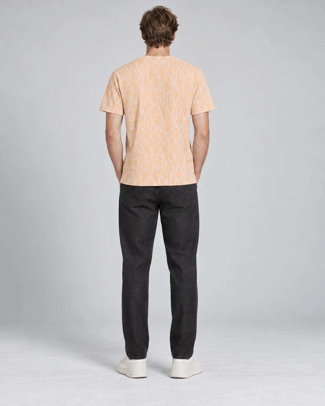 MOMANI Logotype Jacquard T-Shirt in Peach, worn by a model, back view