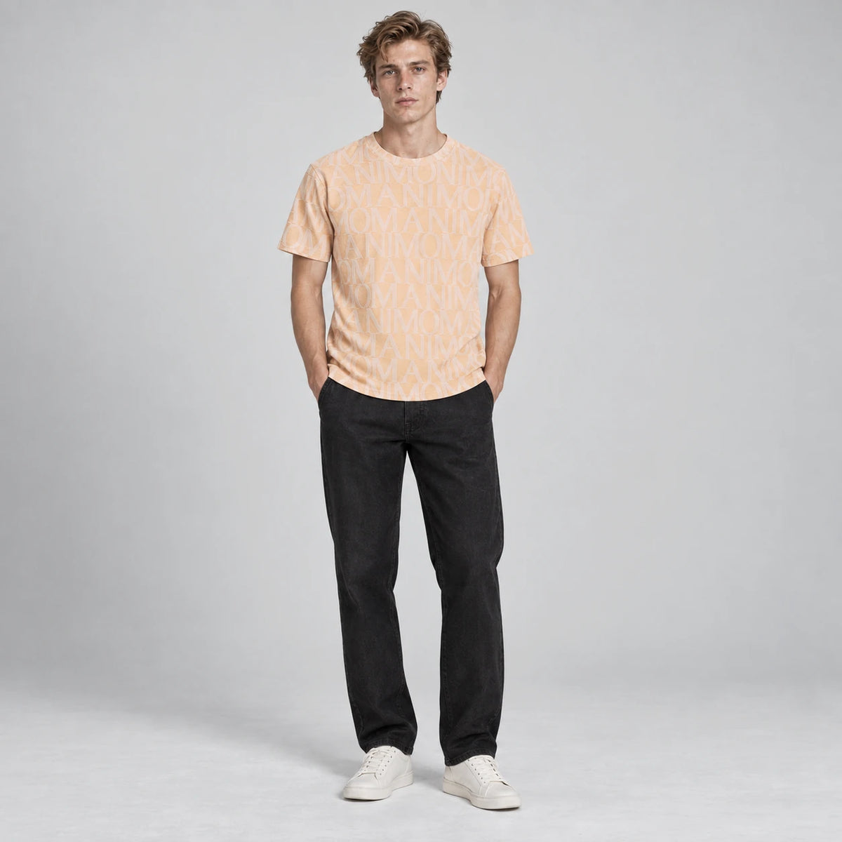 MOMANI Logotype Jacquard T-Shirt in Peach, worn by a model, front view