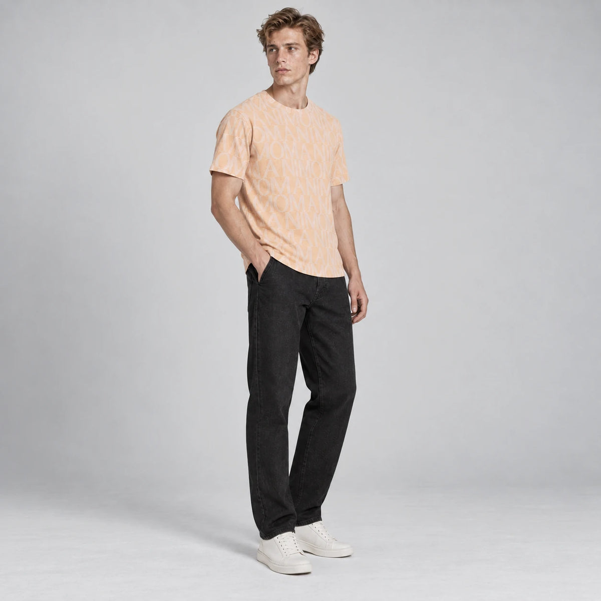 MOMANI Logotype Jacquard T-Shirt in Peach, worn by a model, three-quarter view