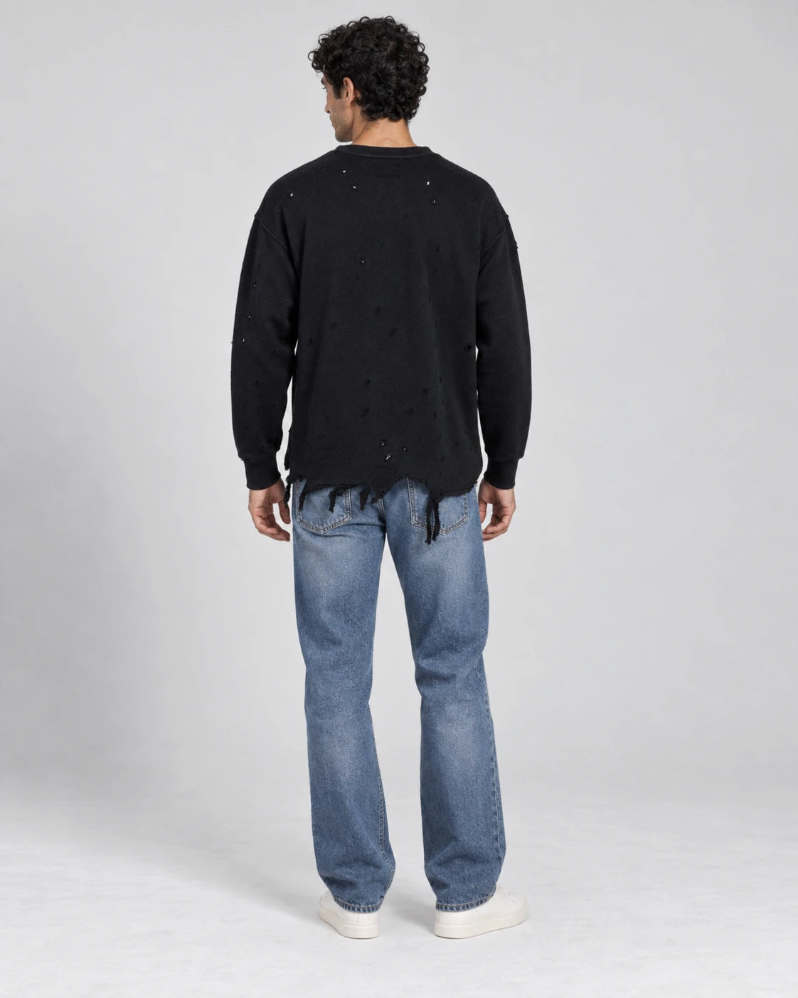 MOMANI Distressed Sweatshirt in Black, worn by a model, back view