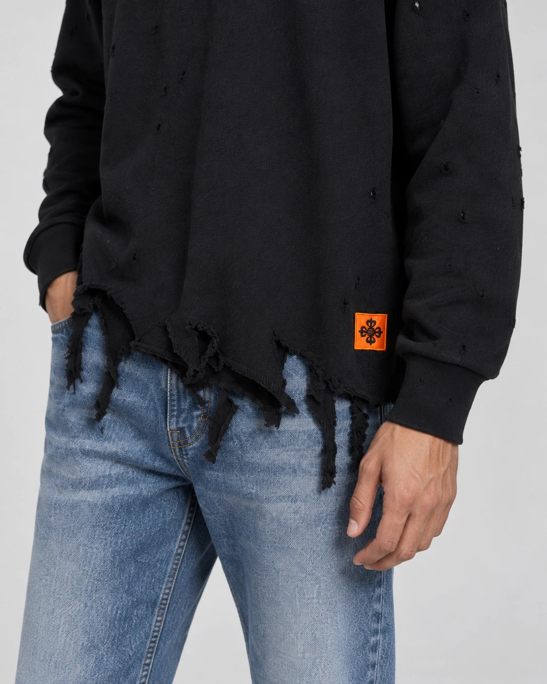 MOMANI Distressed Sweatshirt in Black, worn by a model, close detail
