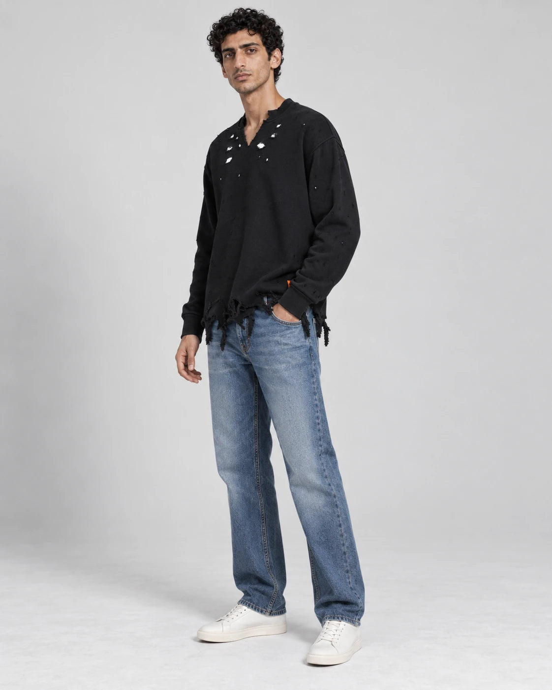 MOMANI Distressed Sweatshirt in Black, worn by a model, three-quarter view