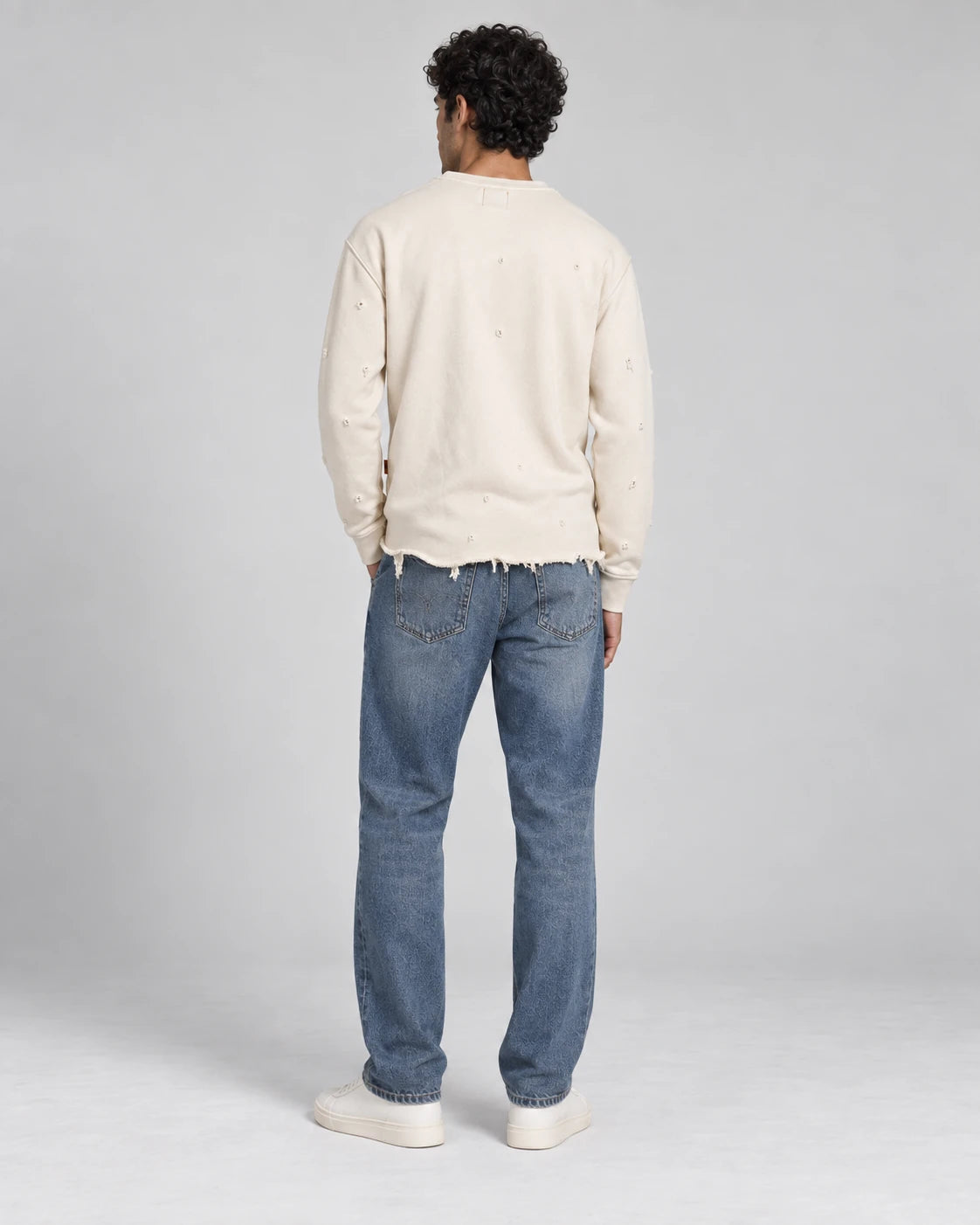 MOMANI Distressed Sweatshirt in Cream, worn by a model, back view