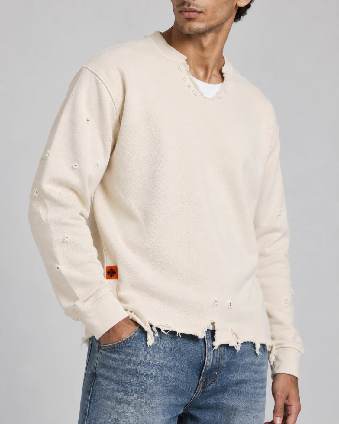 MOMANI Distressed Sweatshirt in Cream, worn by a model, close detail