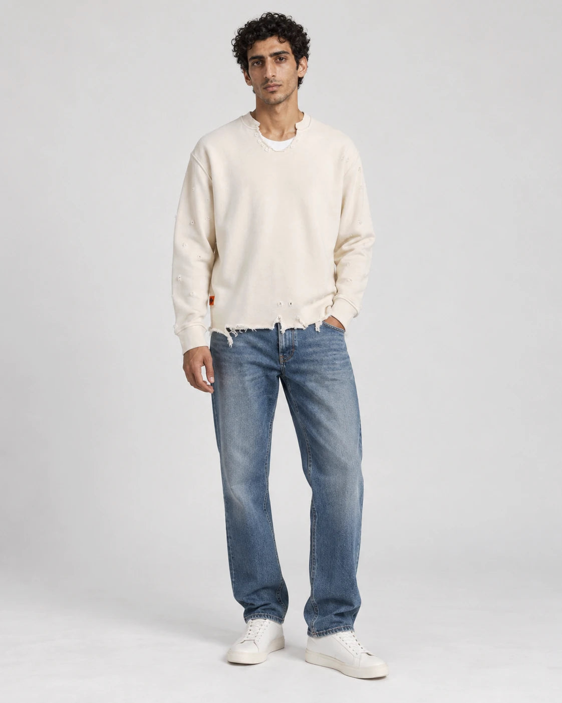 MOMANI Distressed Sweatshirt in Cream, worn by a model, front view