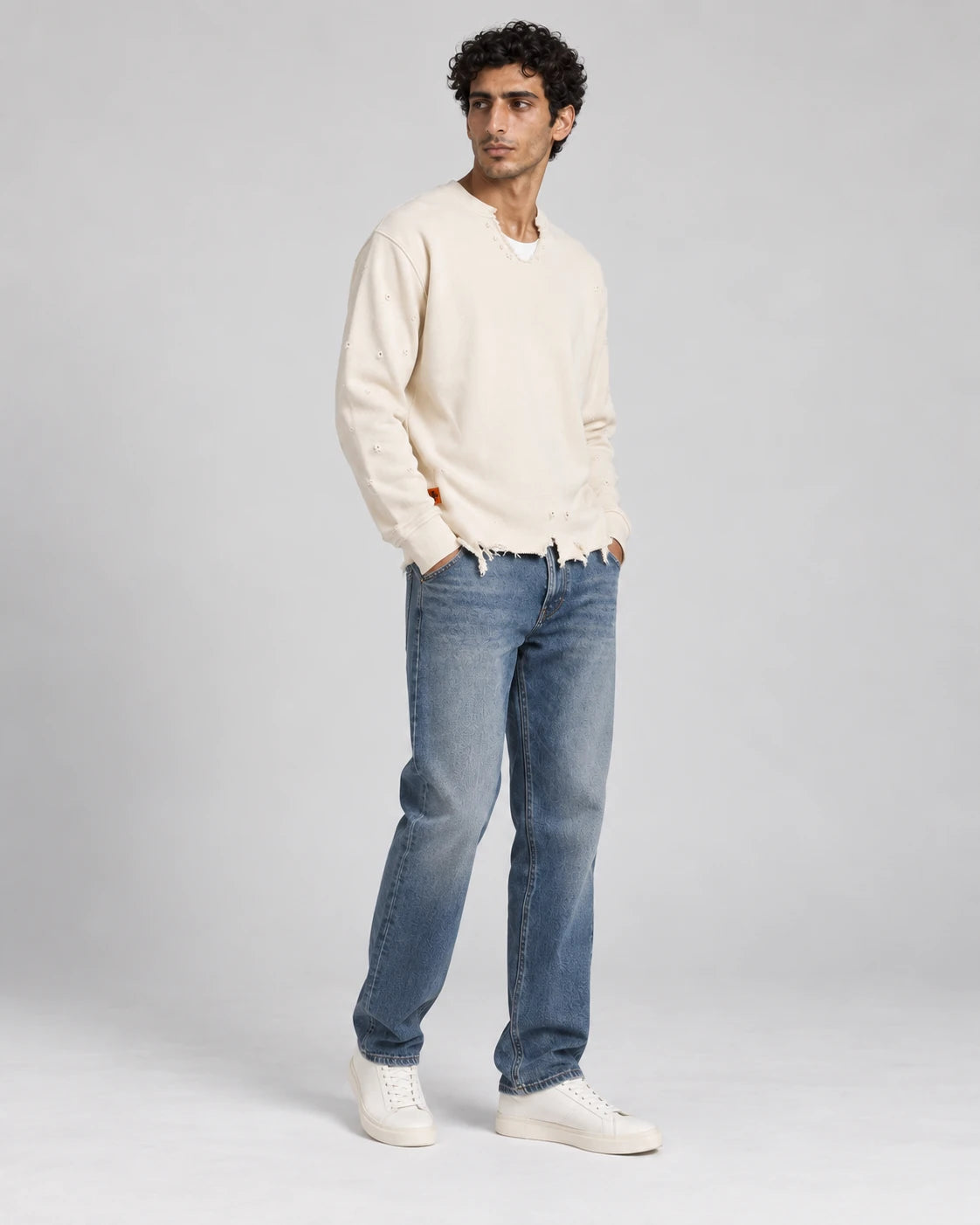 MOMANI Distressed Sweatshirt in Cream, worn by a model, three-quarter view
