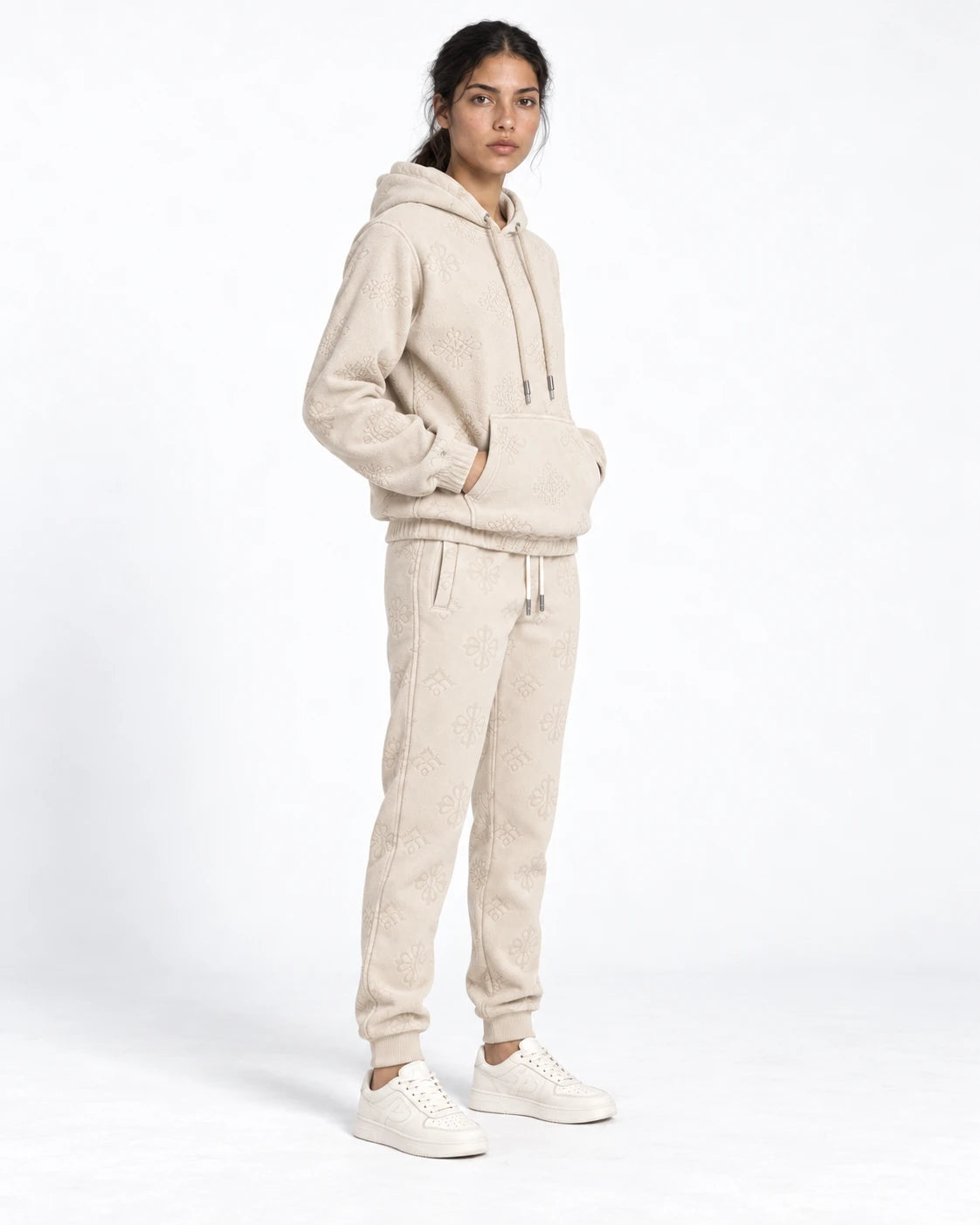 MOMANI Emblem Jacquard Hoodie in Cream, worn by a model, three-quarter view