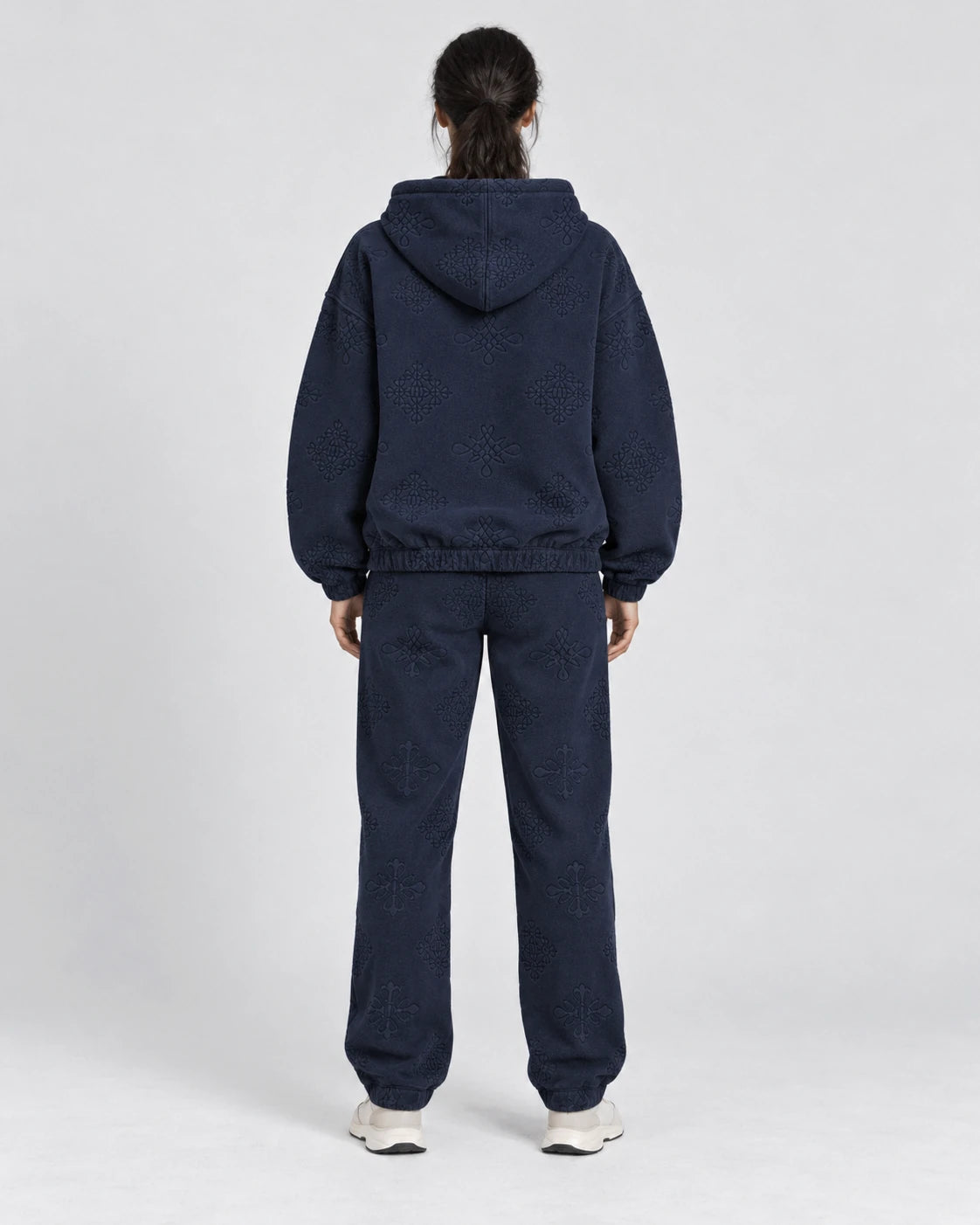 MOMANI Emblem Jacquard Hoodie in Navy, worn by a model, back view