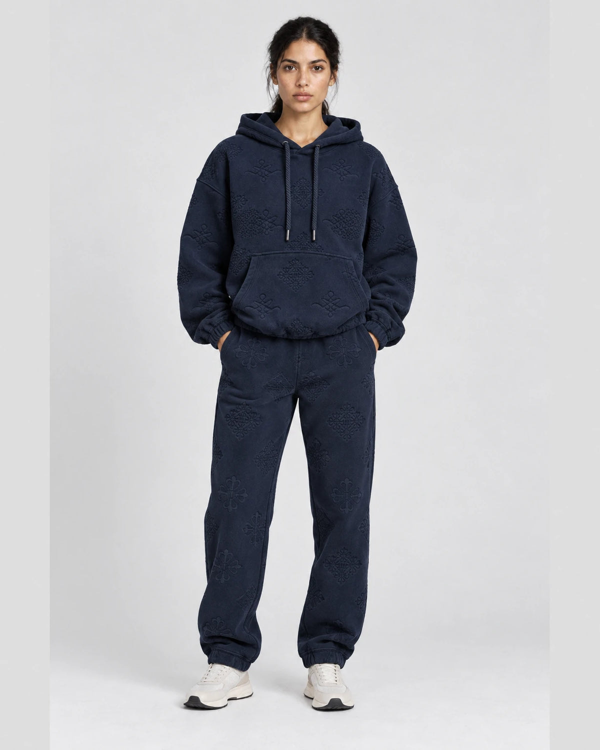 MOMANI Emblem Jacquard Hoodie in Navy, worn by a model, front view