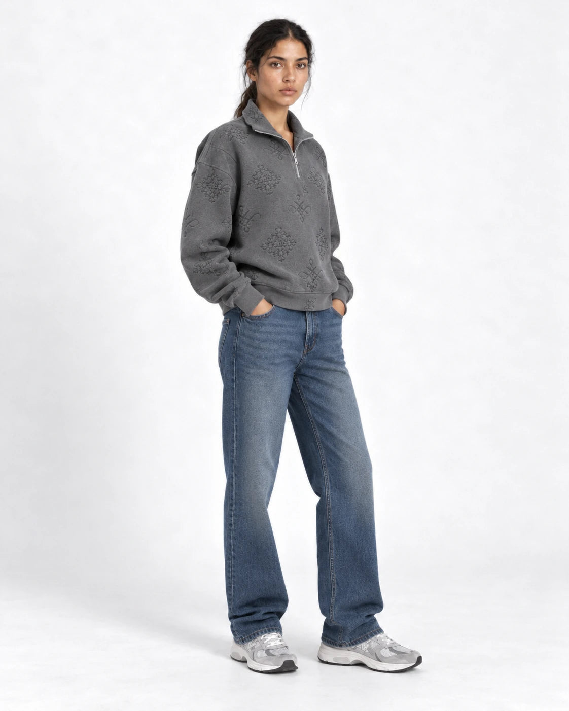 MOMANI Emblem Quarter-Zip Sweatshirt in Grey, worn by a model, three-quarter view