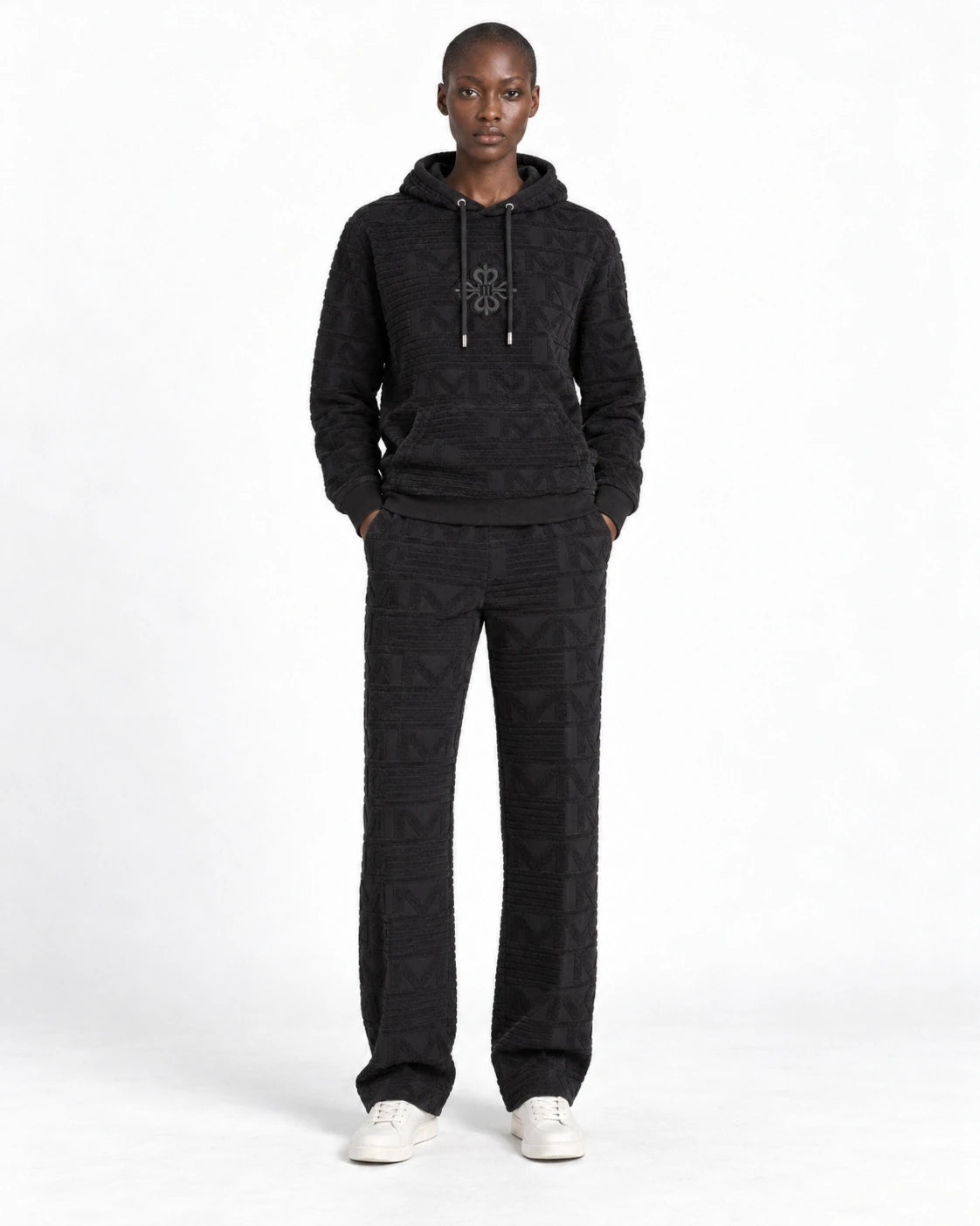 MOMANI Emblem Terry Hoodie in Black, worn by a model, front view