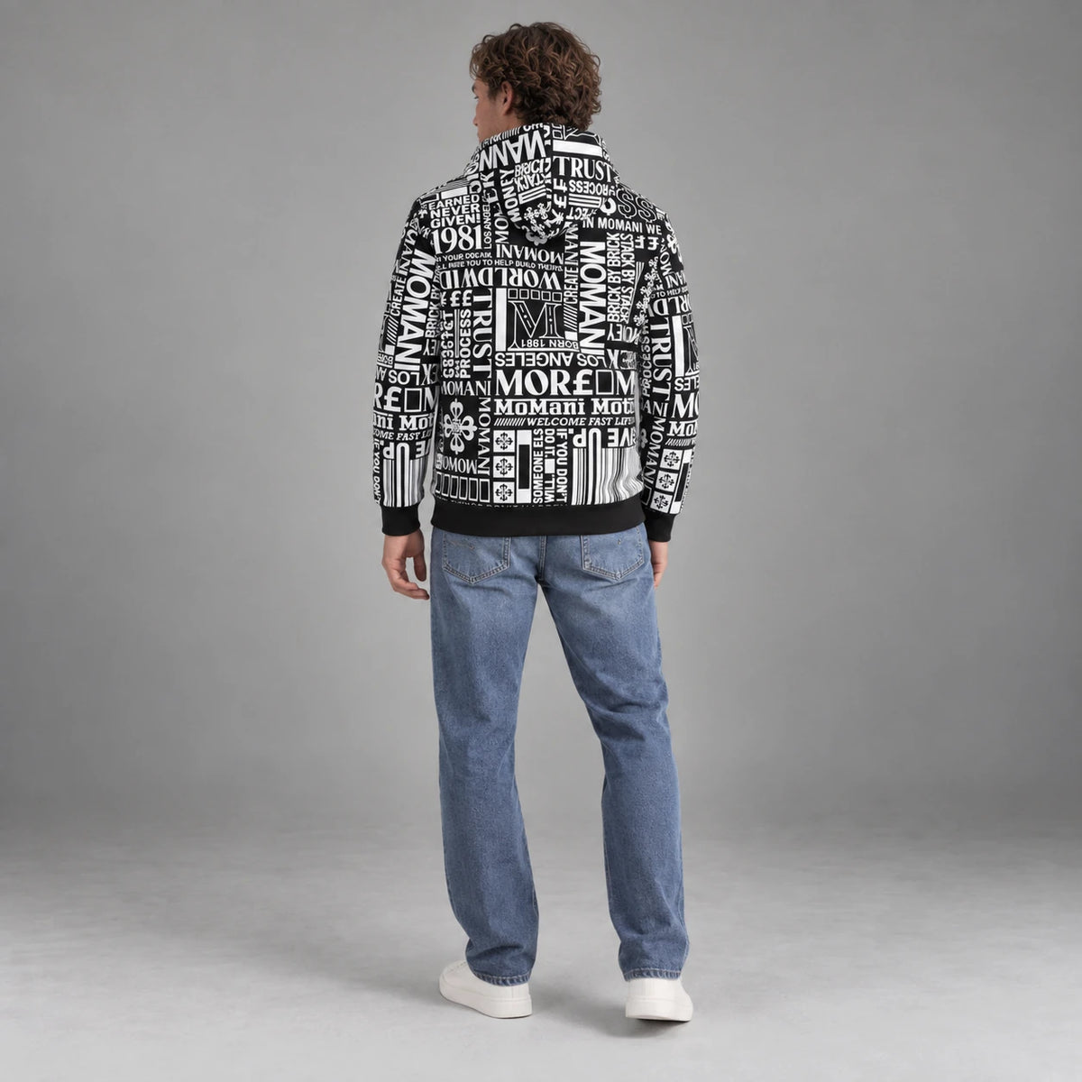 MOMANI Typographic Hoodie in Black, worn by a model, back view