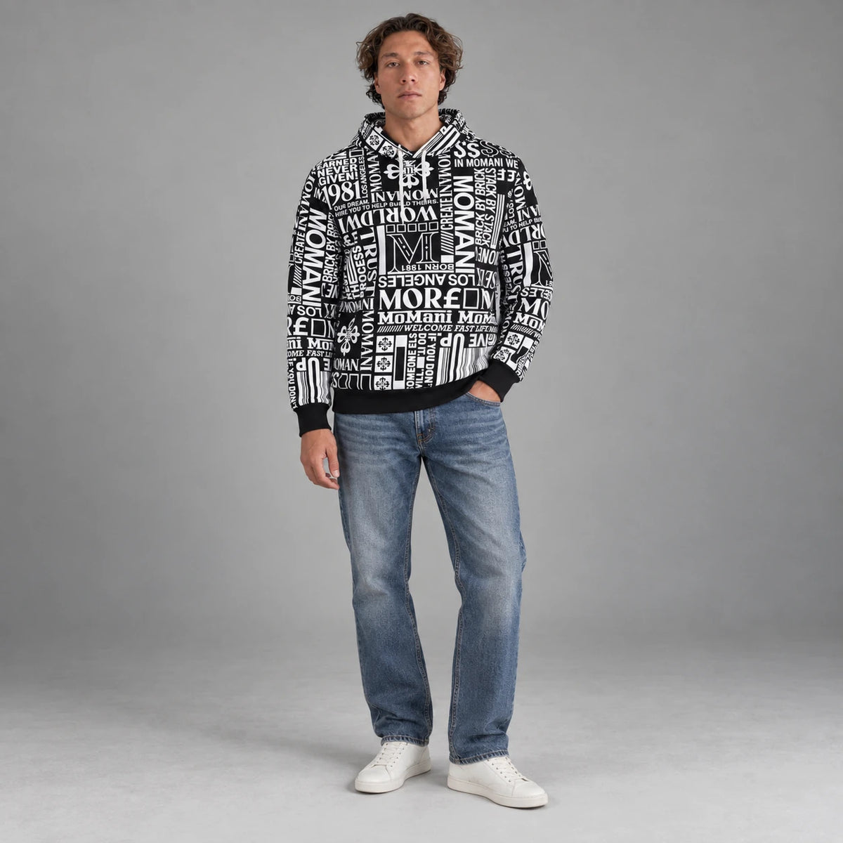 MOMANI Typographic Hoodie in Black, worn by a model, front view