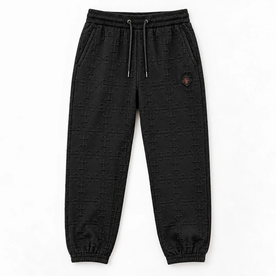 MOMANI Emblem Terry Trousers in Black, laid flat, front view