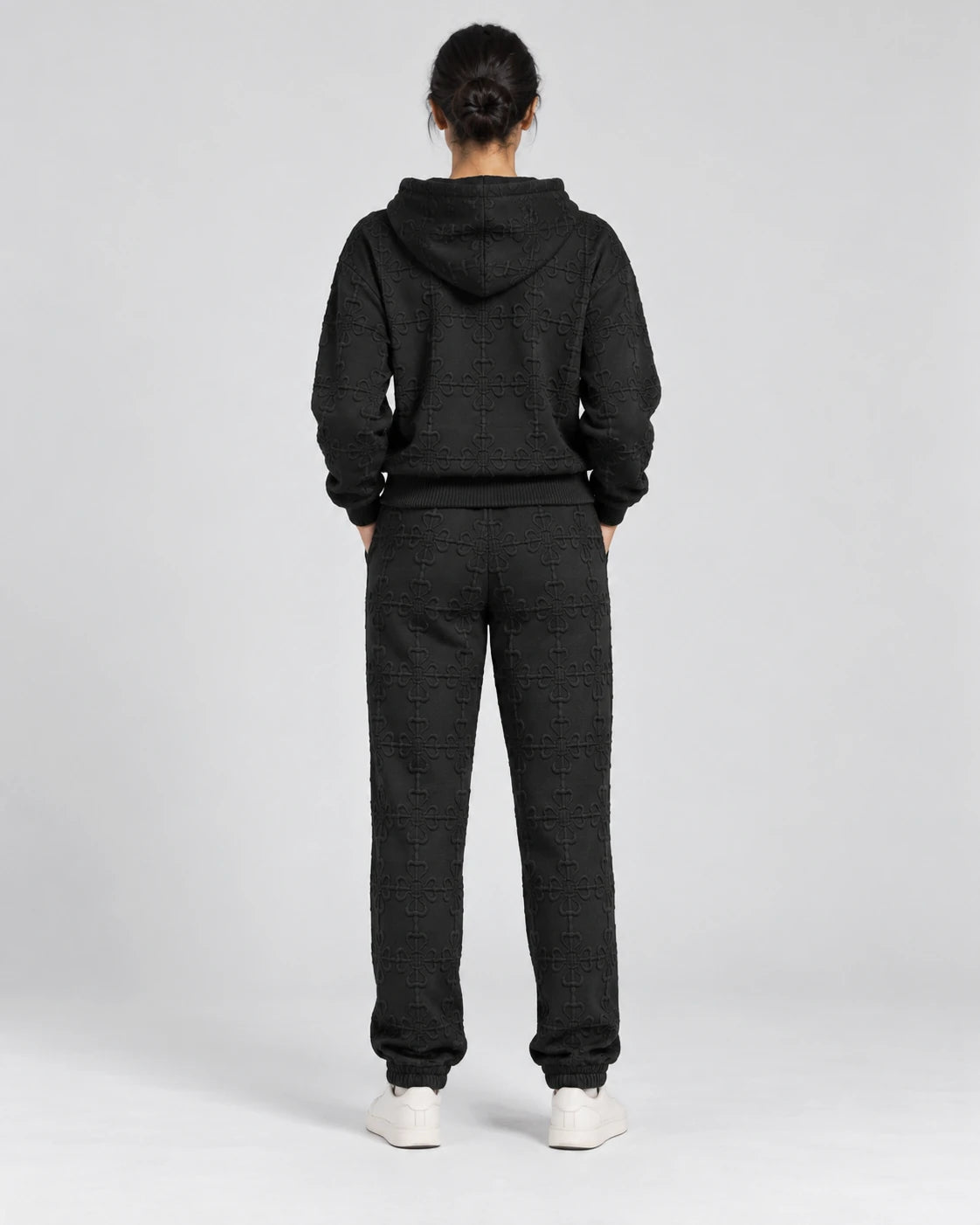 MOMANI Emblem Terry Trousers in Black, worn by a model, back view