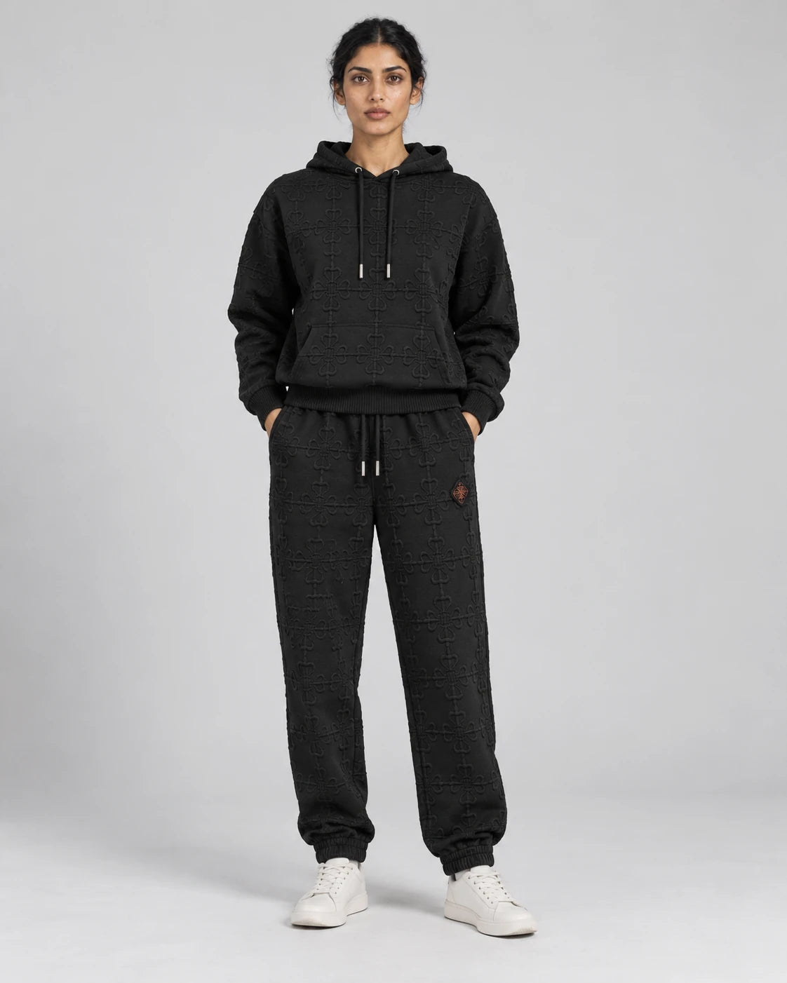 MOMANI Emblem Terry Trousers in Black, worn by a model, front view