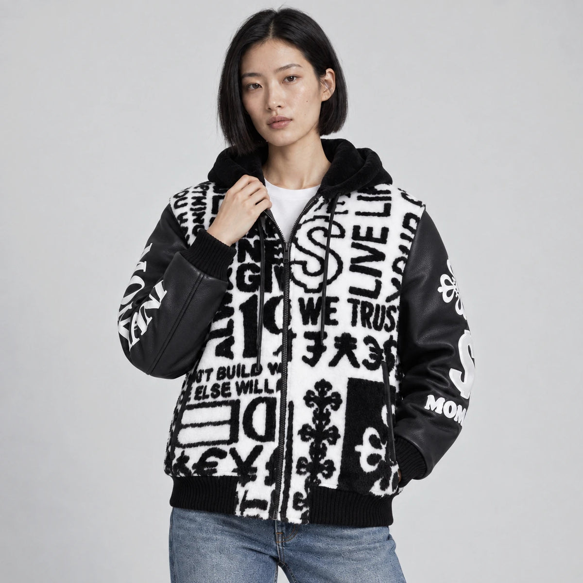 MOMANI Typographic Hooded Coat in Black, worn by a model, close detail