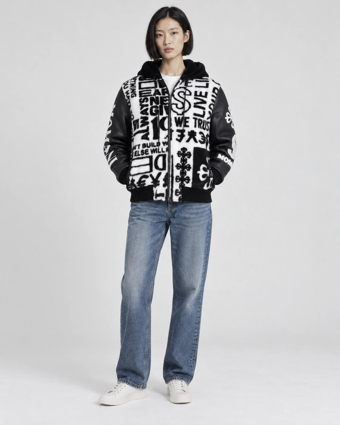 MOMANI Typographic Hooded Coat in Black, worn by a model, front view