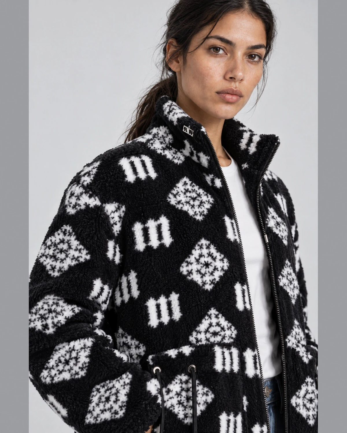MOMANI Monogram Fleece Coat in Black, worn by a model, close detail
